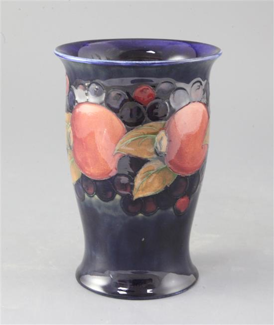 A Moorcroft pomegranate pattern trumpet vase, height 18.5cm